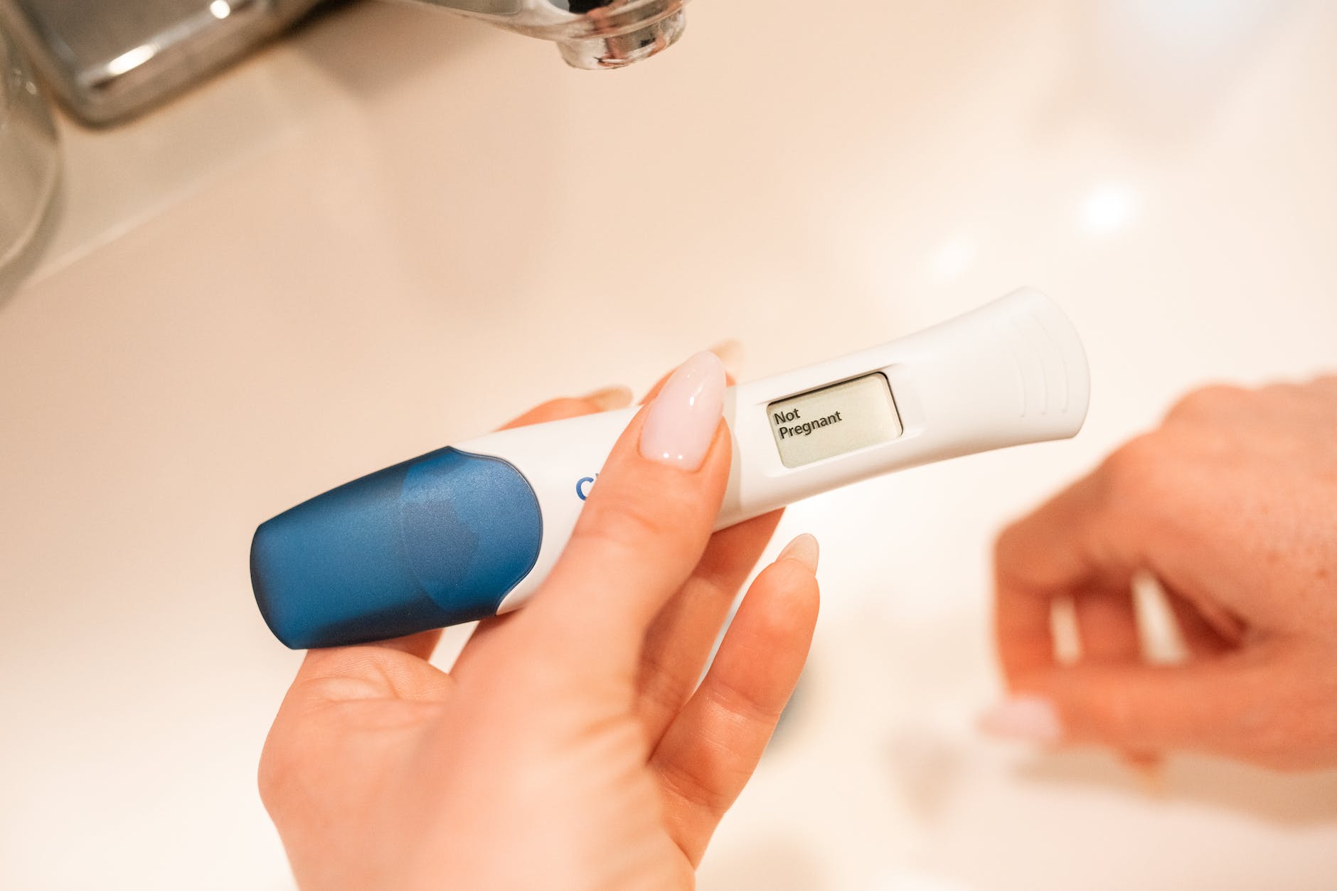 white and blue pregnancy test kit