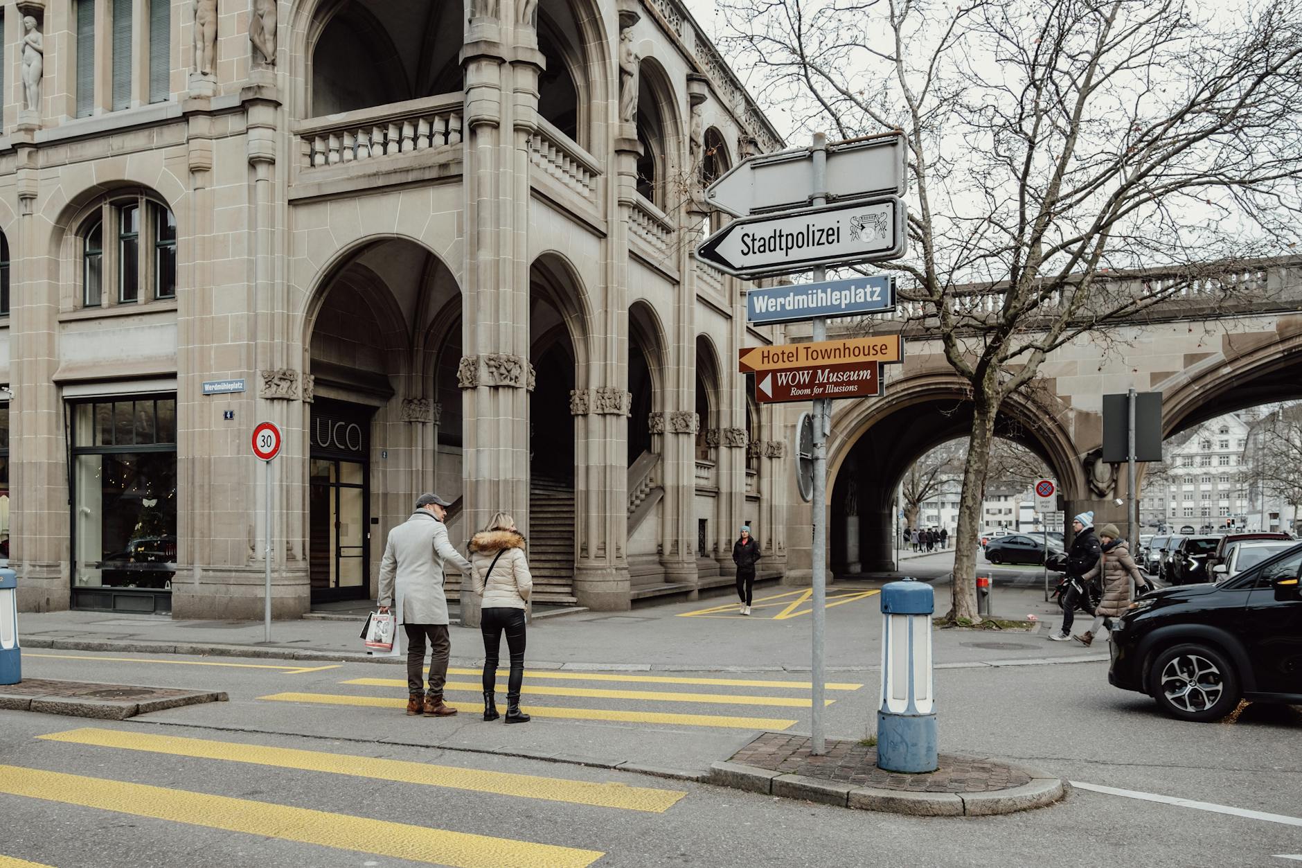 man and woman standing on street in zurich switzerland